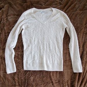 V-neck cable knit sweater.